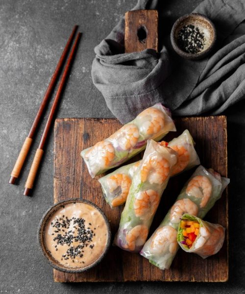 asian-food-board-flat-lay_23-2148771229
